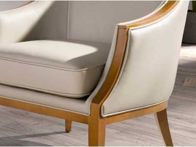 Sillón de diseño clásico tapizado en piel genuina con madera vista - ISABELINNE